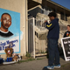 Activists look at a mural of Ezell Ford on Dec. 29, 2014, at the site where the 25-year-old mentally ill man was shot and killed by Los Angeles police in August.
David McNew/Getty Images